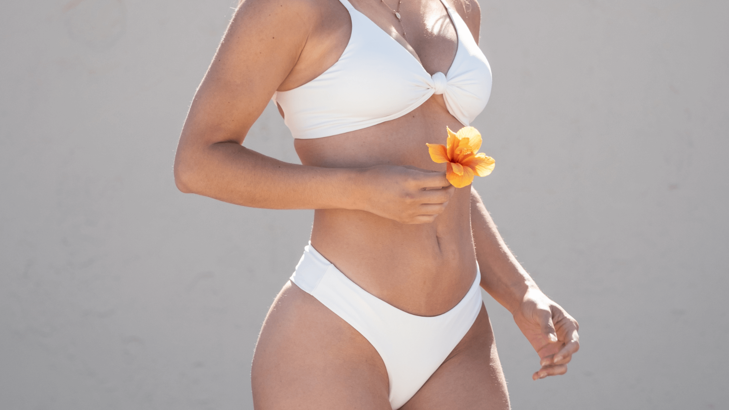 Midori Bikinis size medium bikini displayed on model; flattering fit with eco-friendly LYCRA® XTRA LIFE™ fabric, designed for durability and all-day comfort