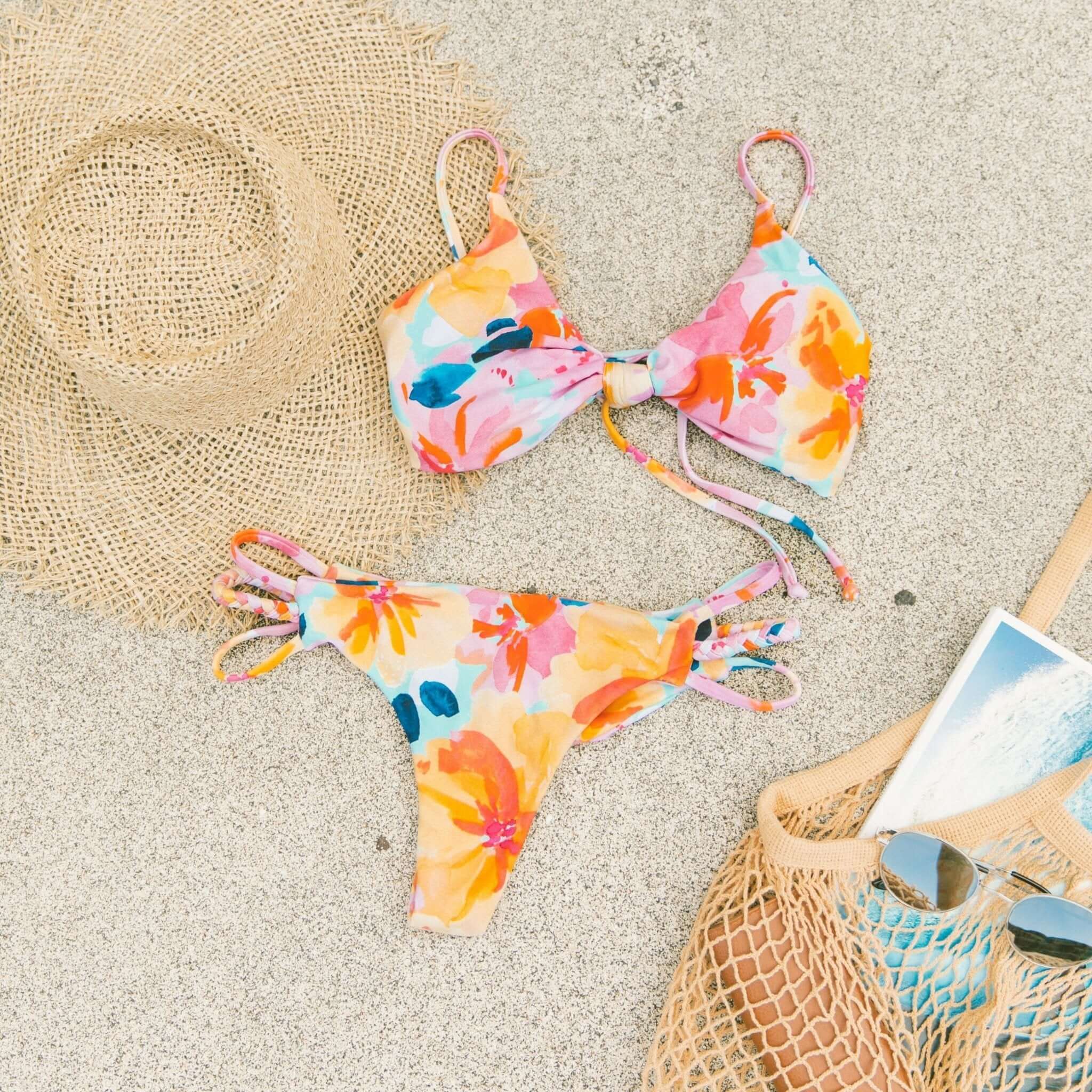Selection of printed bikinis from Midori featuring floral patterns, colorful stripes, polka dots, and tropical prints—made with eco-friendly UPF 50+ fabric